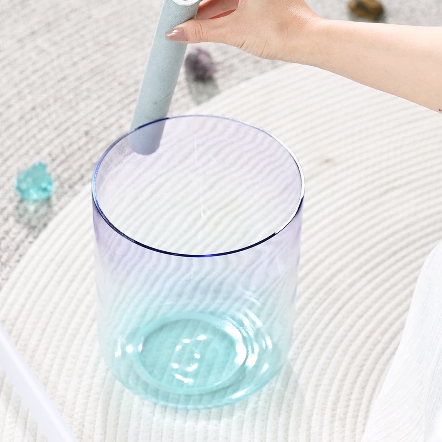 Clear glass with turquoise liquid in Sea Lavender Crystal Singing Bowl for Healing