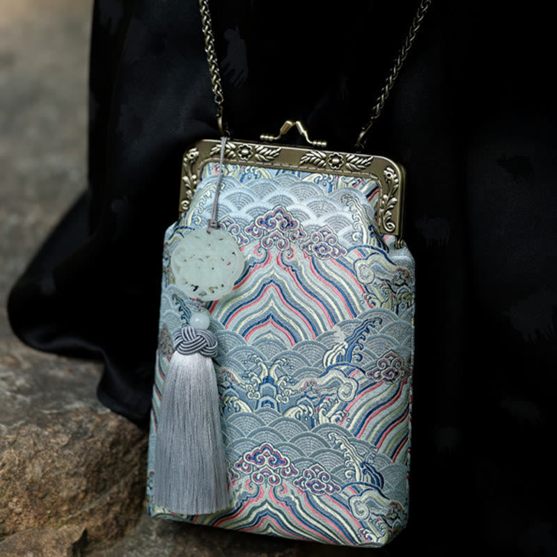 Kleine blaue Umhängetasche mit Meereswellen und Metallkette