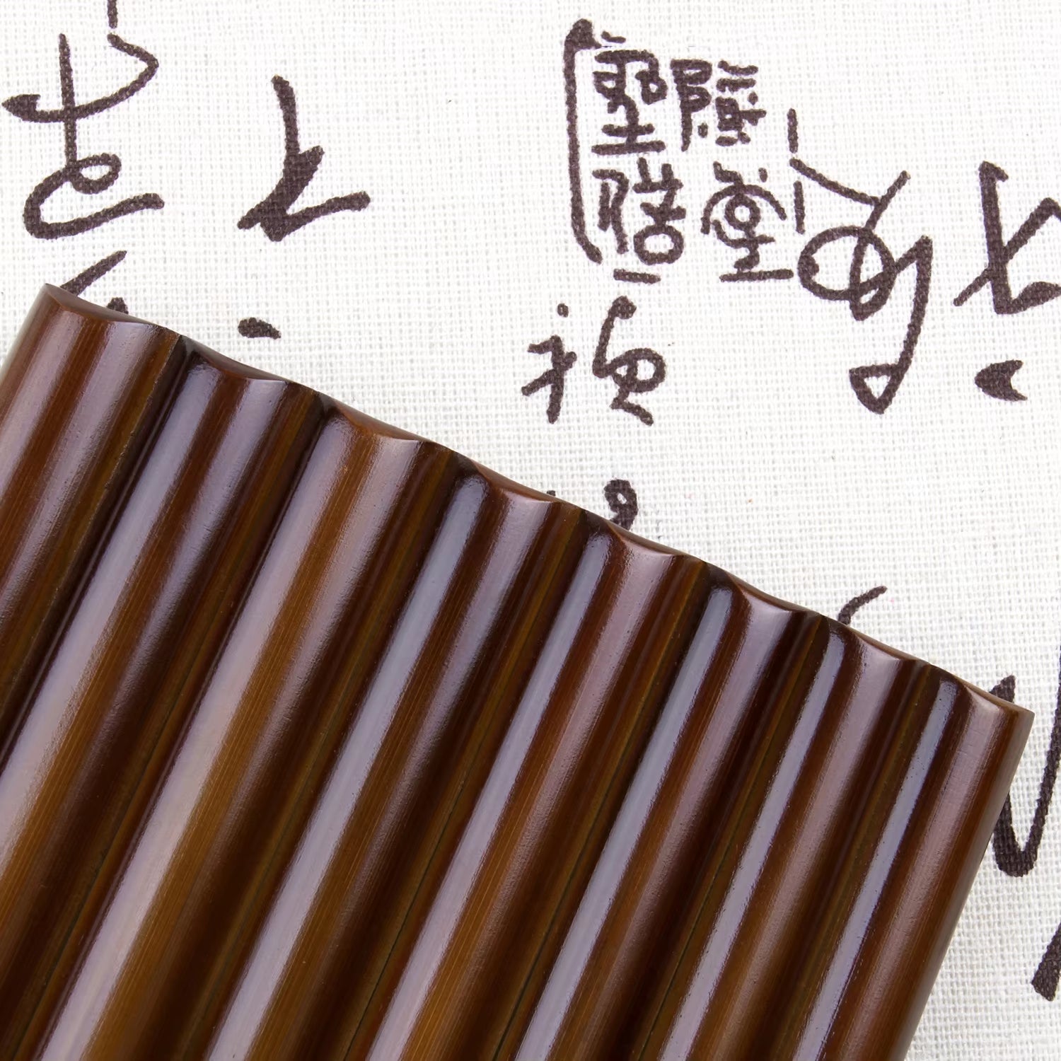 Dark brown corrugated surface with vertical ridges on Small Brown Bamboo Pan Flute