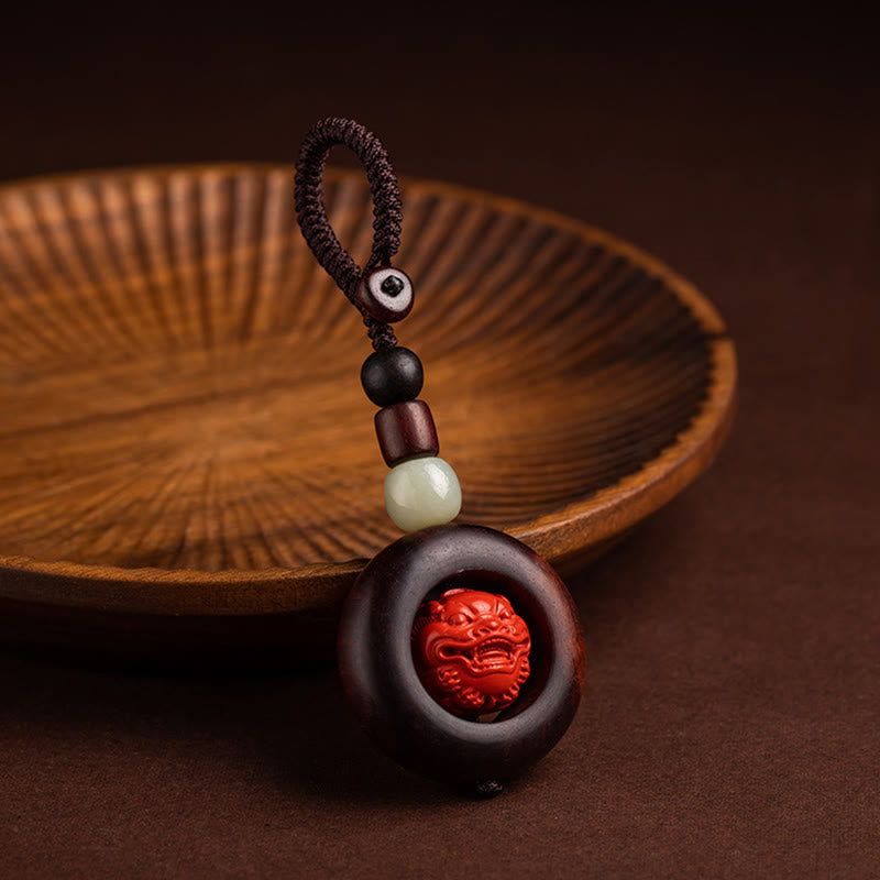Schlüsselanhänger mit kleinem Blatt aus rotem Sandelholz „Om Mani Padme Hum“ zum Schutz