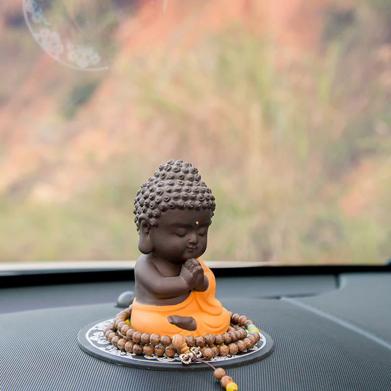 Kleine Buddha-Statue aus violettem Ton für Gelassenheit zu Hause
