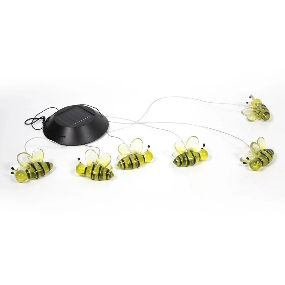 Cat toy with a black base, wire, and yellow-striped bee decorations for outdoor use