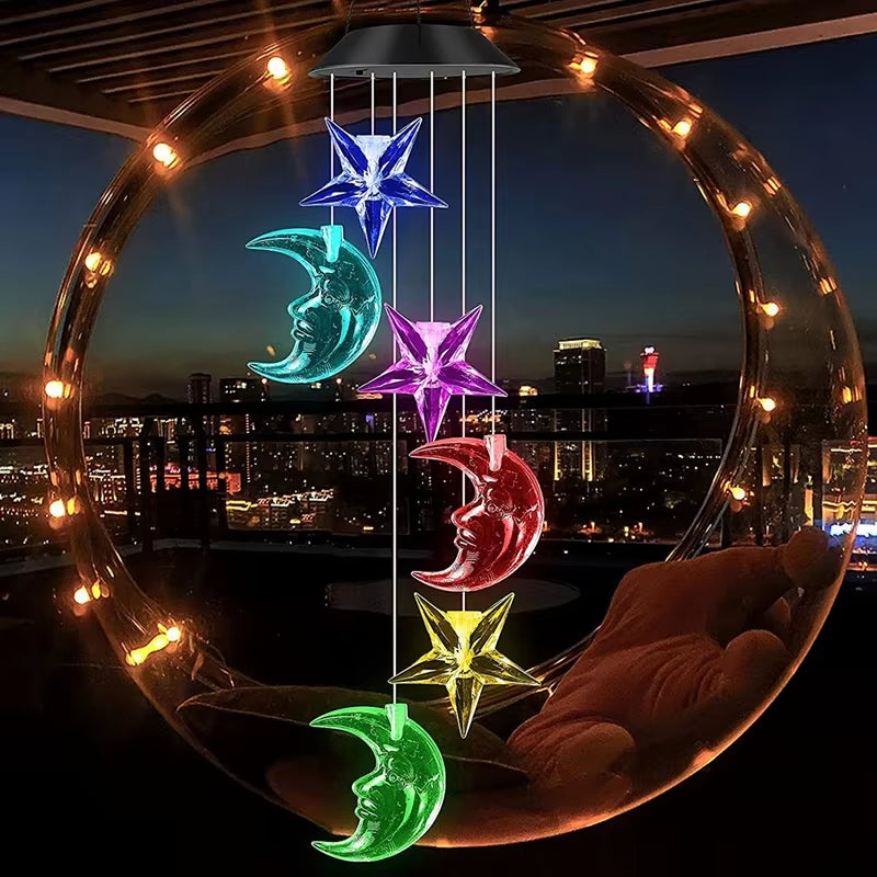 Illuminated wind chime with neon moons and stars in Solar Butterfly Wind Chimes design