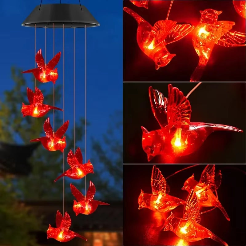 Solar-powered wind chime with red hummingbird lights in a vertical arrangement