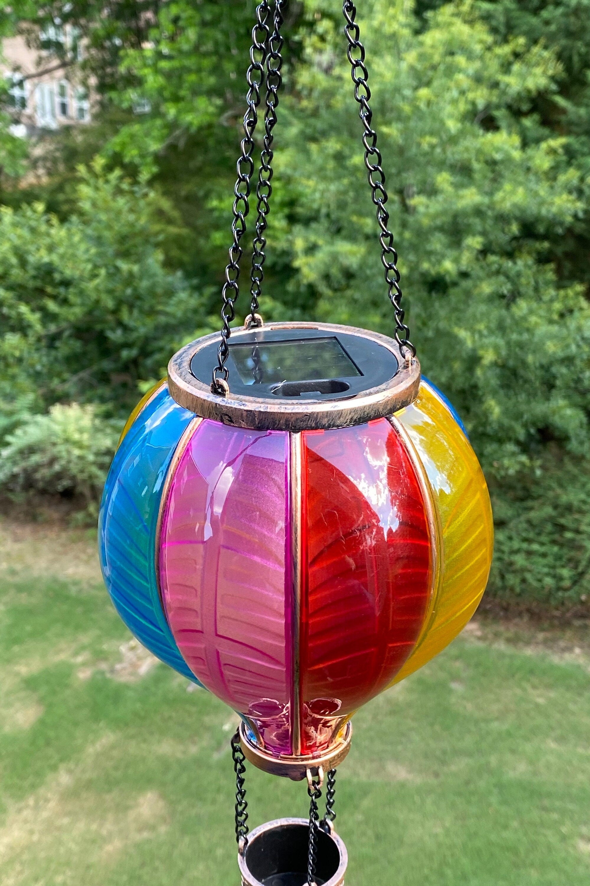 Colorful Solar Wind Chime Lantern with rainbow-striped glass panels for outdoor decor