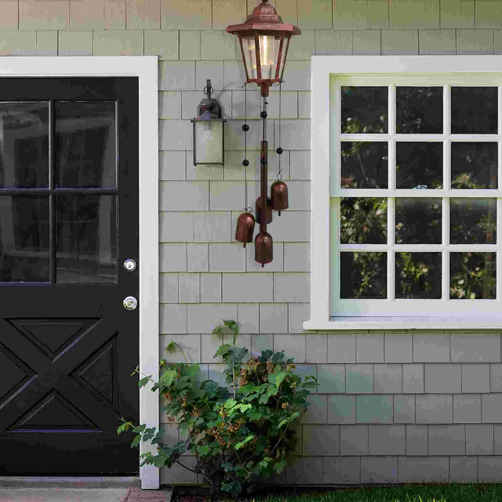 Black wooden door with crossbuck design for Solar Wind Chimes Outdoor Vintage Garden Light