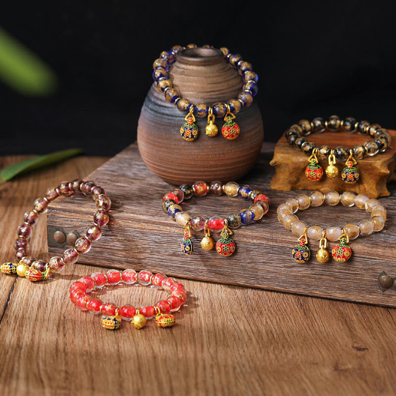 Spirituelles Armband mit goldenem Schlucktier und Liuli-Perlen