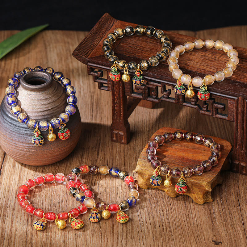 Spirituelles Armband mit goldenem Schlucktier und Liuli-Perlen