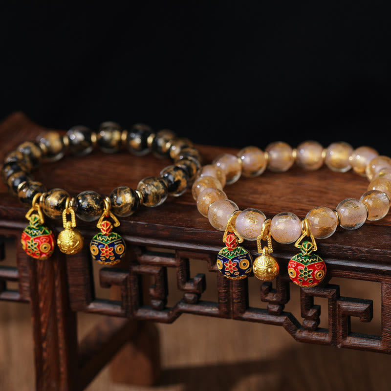 Spirituelles Armband mit goldenem Schlucktier und Liuli-Perlen