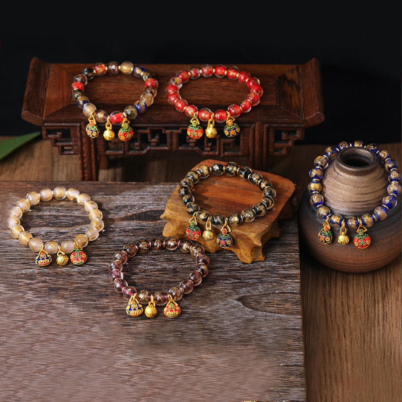 Spirituelles Armband mit goldenem Schlucktier und Liuli-Perlen