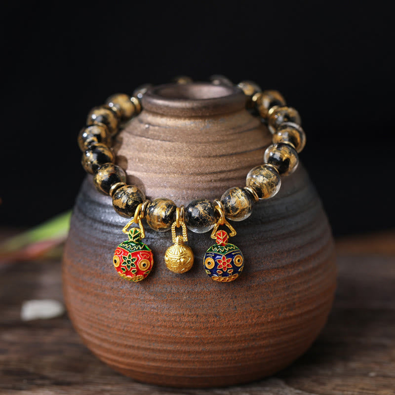 Spirituelles Armband mit goldenem Schlucktier und Liuli-Perlen