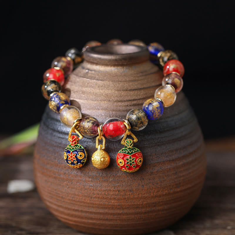 Spirituelles Armband mit goldenem Schlucktier und Liuli-Perlen