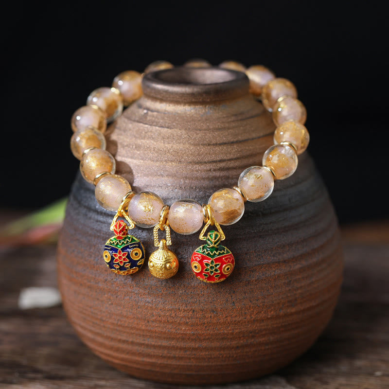 Spirituelles Armband mit goldenem Schlucktier und Liuli-Perlen
