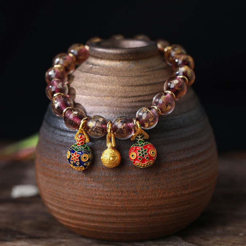 Spirituelles Armband mit goldenem Schlucktier und Liuli-Perlen