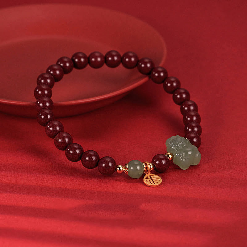Drachenarmband aus Sterlingsilber mit Zinnober- und Jadeanhängern