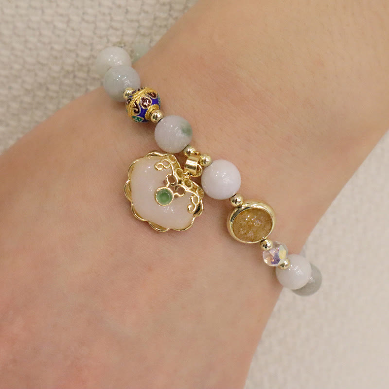 Heilarmband aus Erdbeerquarz mit chinesischem Schlossanhänger