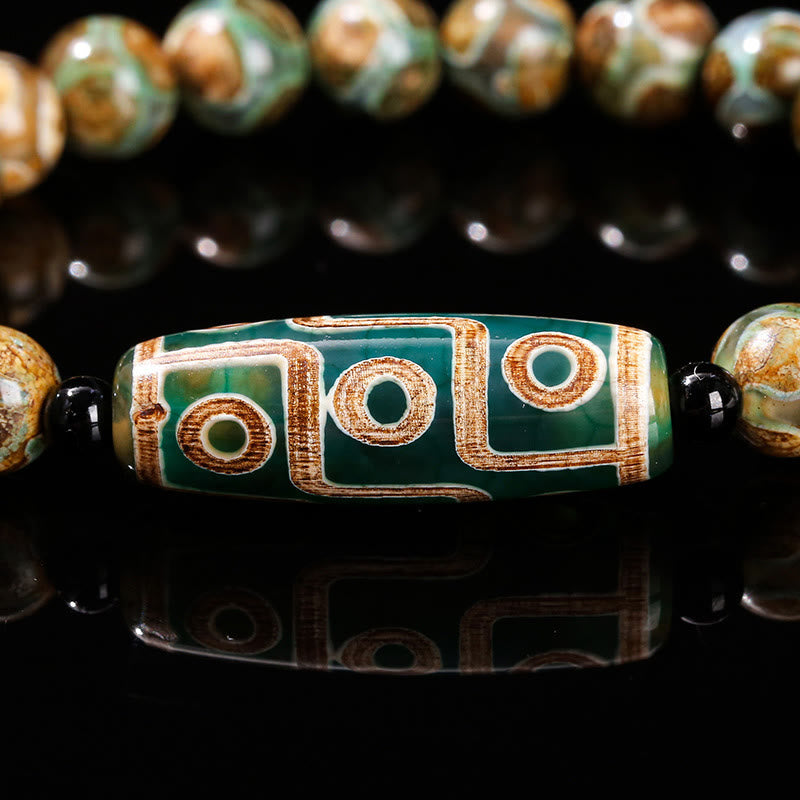 Tibetisches Neun-Augen-Dzi-Perlenarmband mit spirituellem Schutz
