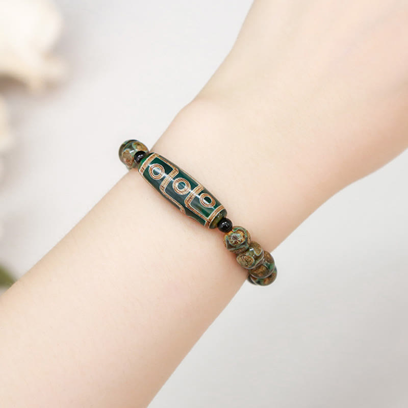 Tibetisches Neun-Augen-Dzi-Perlenarmband mit spirituellem Schutz