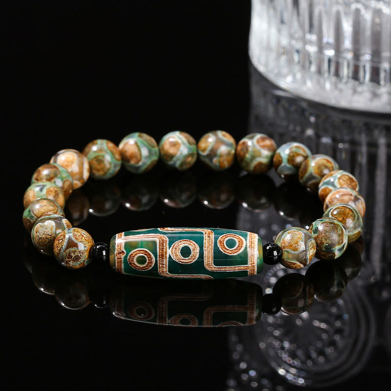 Tibetisches Neun-Augen-Dzi-Perlenarmband mit spirituellem Schutz