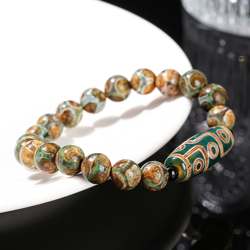Tibetisches Neun-Augen-Dzi-Perlenarmband mit spirituellem Schutz