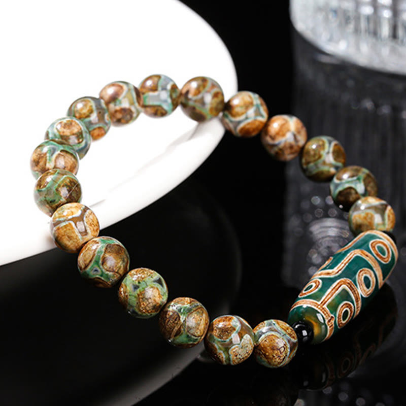 Tibetisches Neun-Augen-Dzi-Perlenarmband mit spirituellem Schutz