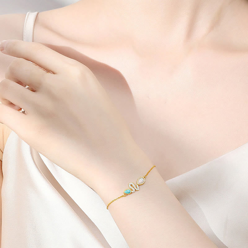 Türkisfarbenes Opal-Schlangenschutzarmband 2025