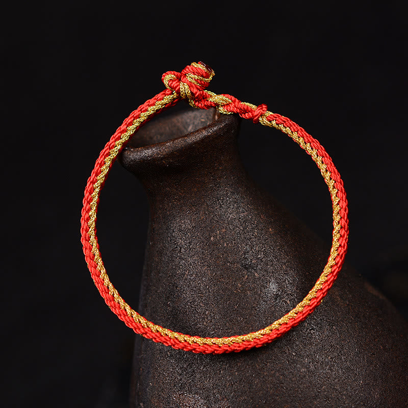 Zweifarbiges, handgefertigtes Armband mit acht Fäden und rotem Peace-Knoten