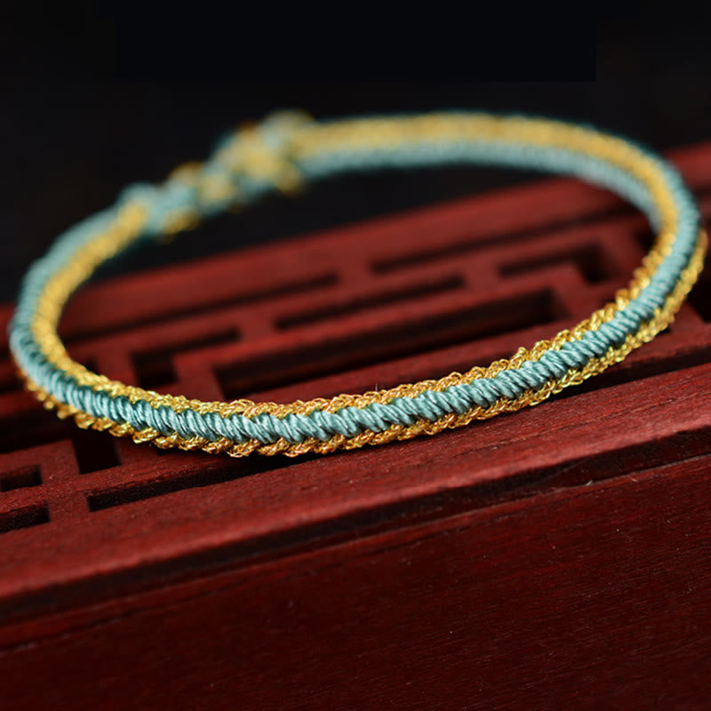 Zweifarbiges, handgefertigtes Armband mit acht Fäden und rotem Peace-Knoten