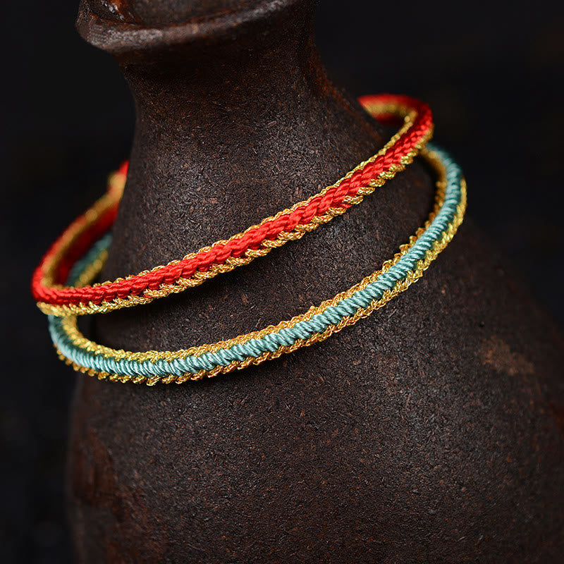 Zweifarbiges, handgefertigtes Armband mit acht Fäden und rotem Peace-Knoten
