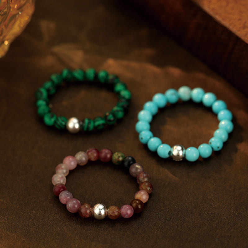 Elastischer Ring aus weißer Jade und schwarzem Onyx mit Kristallperlen