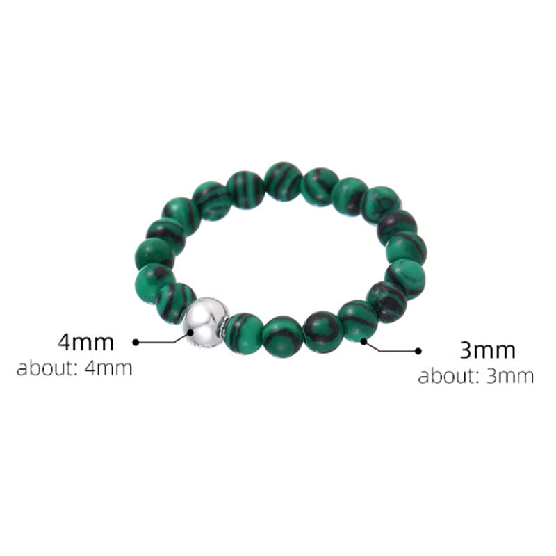 Elastischer Ring aus weißer Jade und schwarzem Onyx mit Kristallperlen