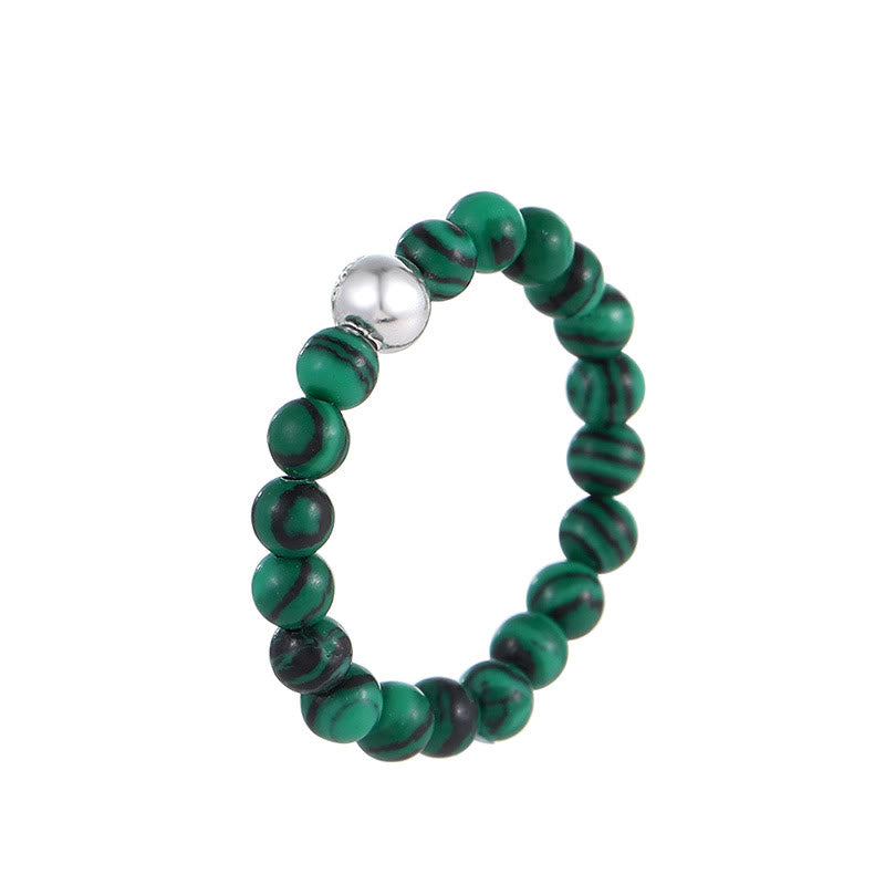 Elastischer Ring aus weißer Jade und schwarzem Onyx mit Kristallperlen