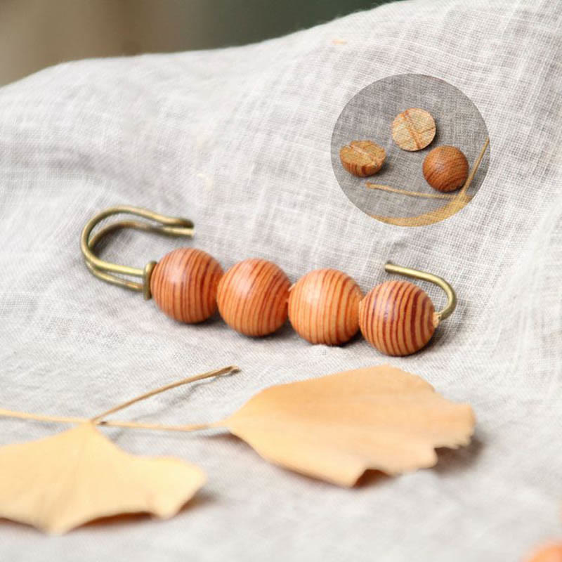 Heilbrosche aus Holz mit Sandelholz-Agathis-Alba-Perlen