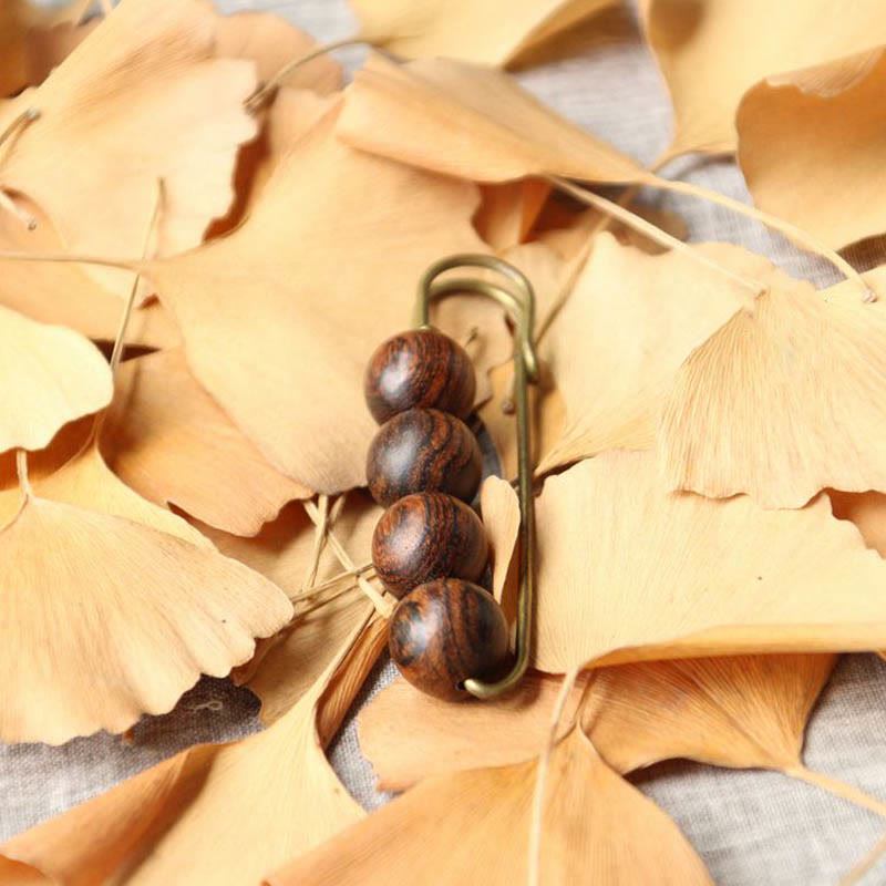 Heilbrosche aus Holz mit Sandelholz-Agathis-Alba-Perlen